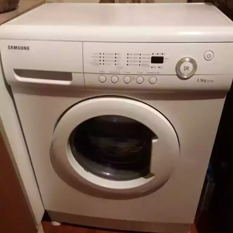 Извлечение постороннего предмета из бака стиральной машины